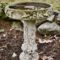 L05. Concrete birdbath with hummingbird design. 